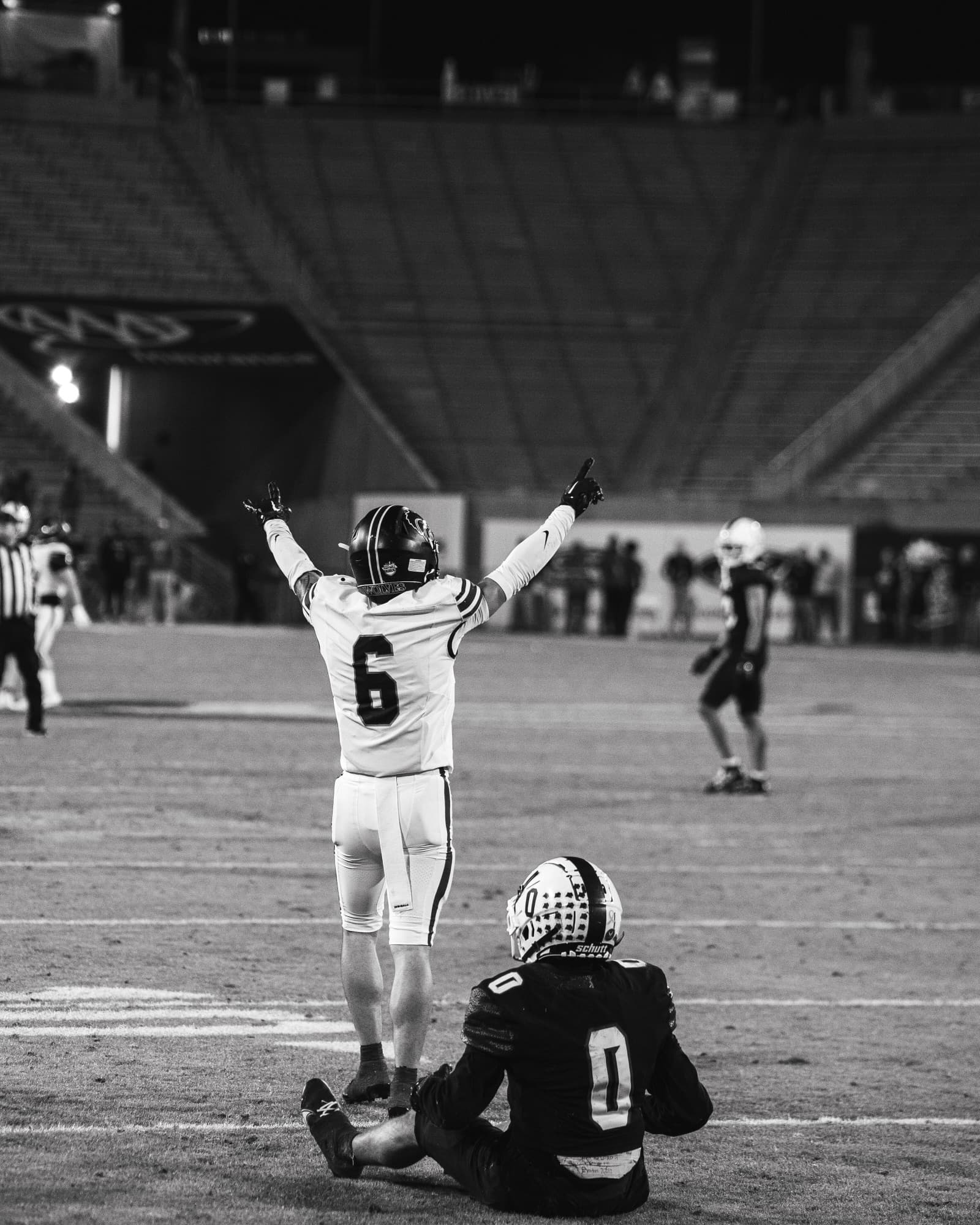Quarterback celebrating with arms raised at the 5A championship